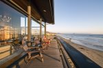 Wrap-around deck on three sides of living room, overlooking the Pacific